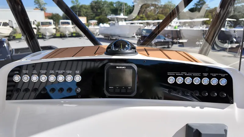 Slide: The Image of Control panel of 2025 Pioneer 222 Islander boat with navigation instruments. - 11