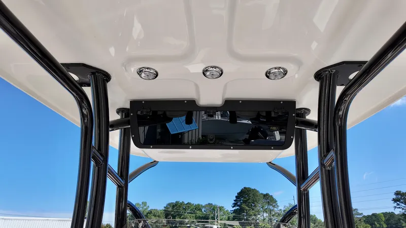 Slide: The Image of 2025 Pioneer 222 Islander boat T-top with integrated lights and storage. - 12