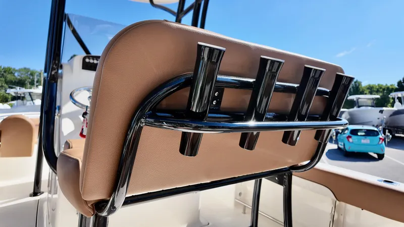 Slide: The Image of 2025 Pioneer 222 Islander boat seat with rod holders, sunny day. - 14