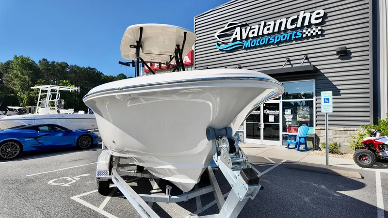Slide: The Image of 2025 Pioneer 222 Islander boat on trailer at Avalanche Motorsports dealership. - 2
