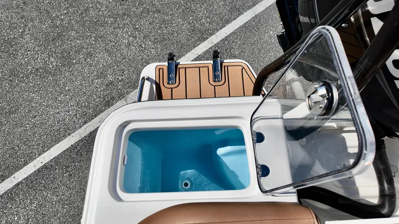 Slide: The Image of 2025 Pioneer 222 Islander boat with open storage compartment and seating area. - 21