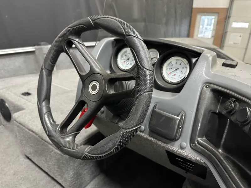 Slide: The Image of Steering wheel and dashboard of 2017 Lund 1675 Impact SS boat. - 12