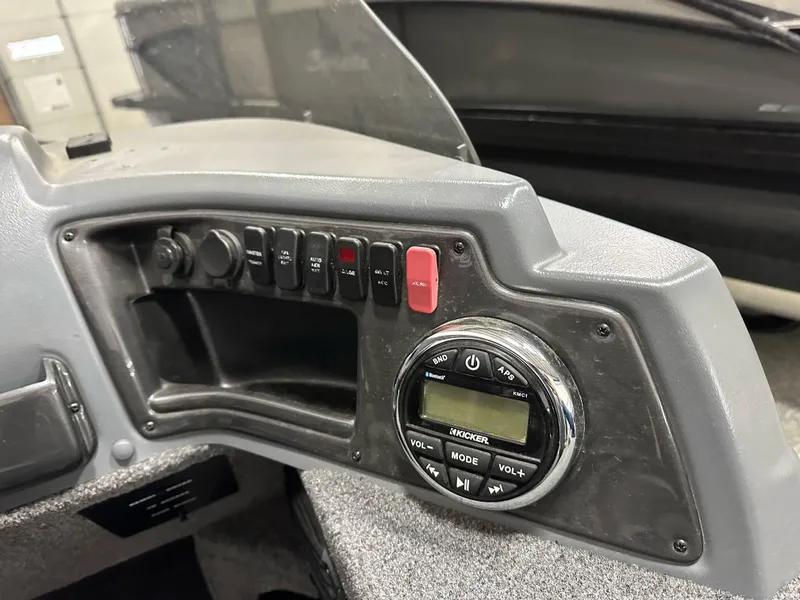 Slide: The Image of Control panel of 2017 Lund 1675 Impact SS boat with radio and switches. - 13