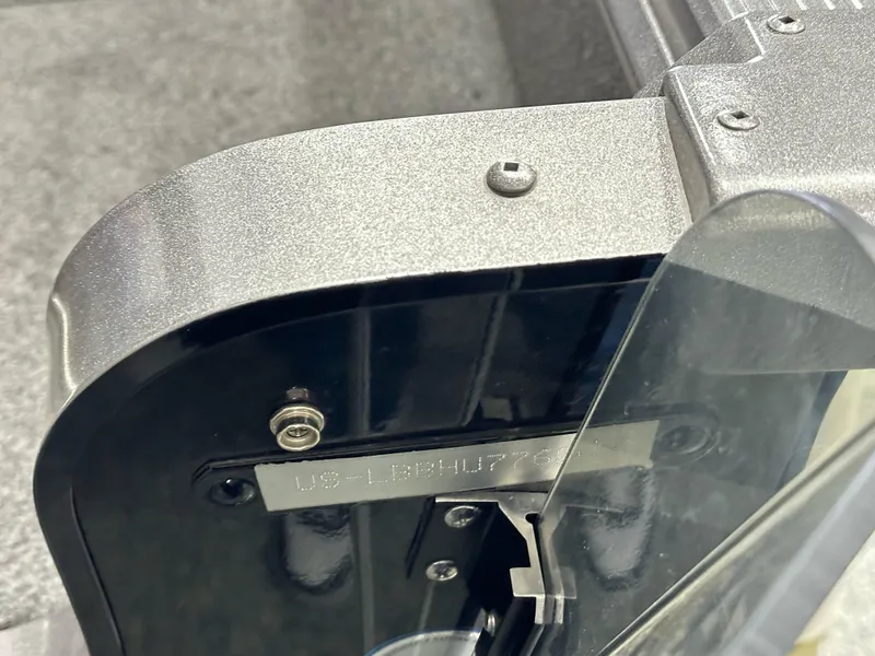 Slide: The Image of 2017 Lund 1675 Impact SS boat detail showing serial number plate and hardware. - 17