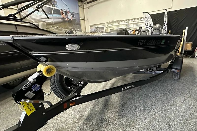 Slide: The Image of 2017 Lund 1675 Impact SS boat on trailer in showroom. - 5