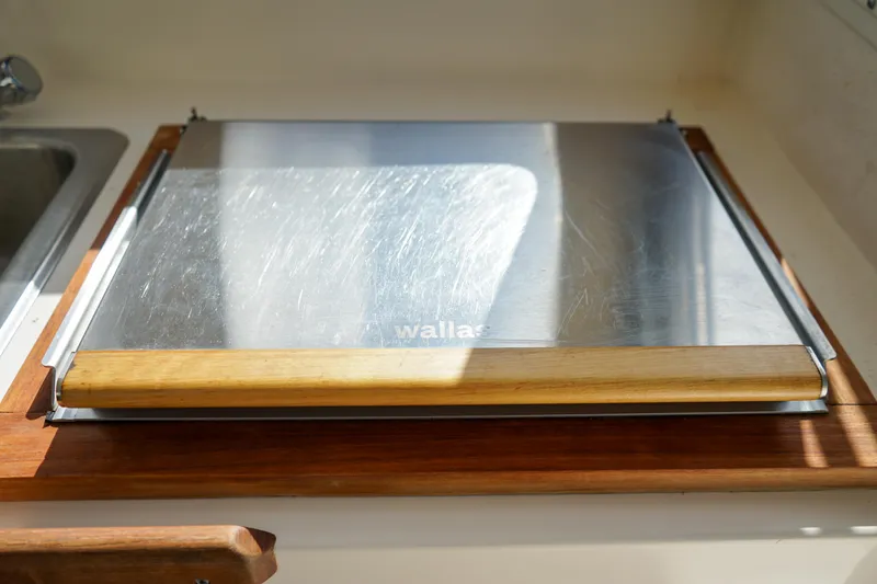 Slide: The Image of Stainless steel stove cover on 2016 C-Dory 22' Cruiser boat kitchen. - 10