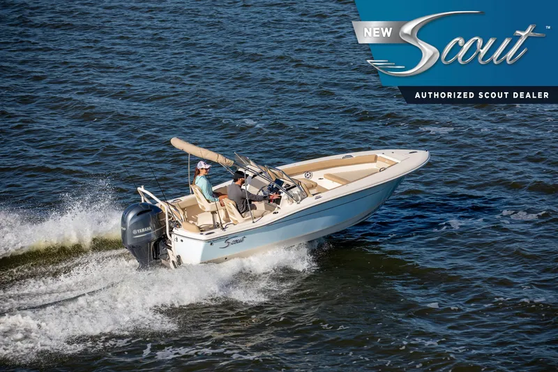 Slide: The Image of 2026 Scout 195 Sport Dorado boat cruising on open water, featuring Yamaha engine. - 1
