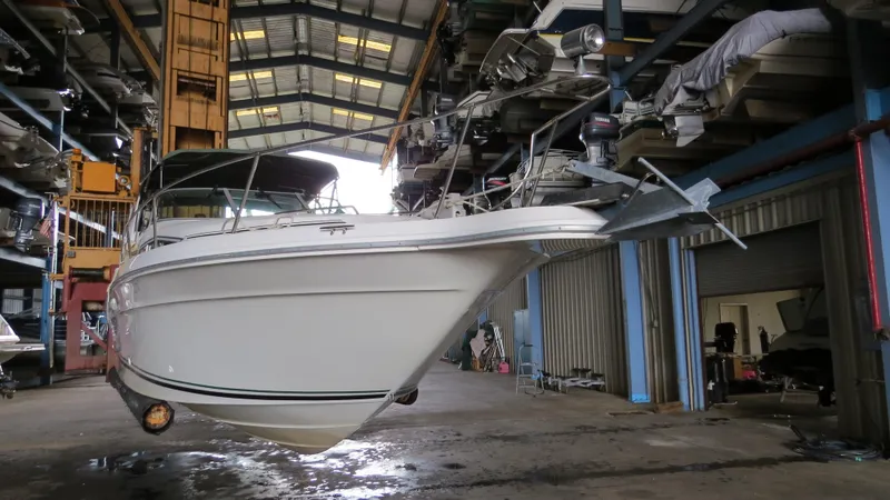 Slide: The Image of 1989 Sea Ray Sundancer 280 in a boat storage facility. - 10