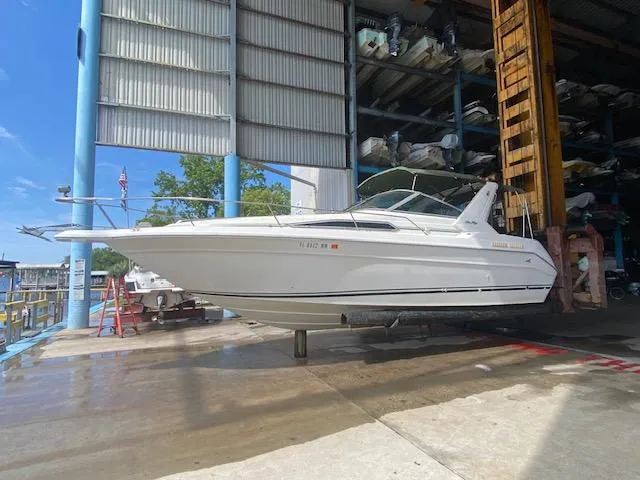 Slide: The Image of 1989 Sea Ray Sundancer 280 boat in dry dock storage. - 24