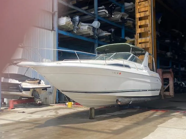 Slide: The Image of 1989 Sea Ray Sundancer 280 boat in storage facility, side view. - 25