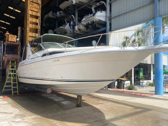 Slide: The Image of 1989 Sea Ray Sundancer 280 boat in storage facility, side view. - 26