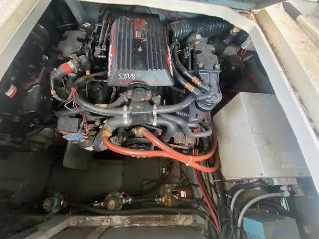 Slide: The Image of Engine compartment of a 1989 Sea Ray Sundancer 280 boat, featuring a 5.7L V8 engine. - 28