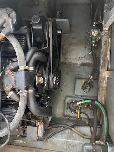 Slide: The Image of Engine compartment of a 1989 Sea Ray Sundancer 280 boat, showing belts and hoses. - 31