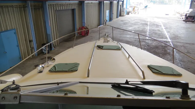 Slide: The Image of 1989 Sea Ray Sundancer 280 boat docked in a storage facility. - 6