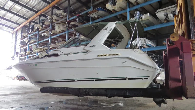Slide: The Image of 1989 Sea Ray Sundancer 280 boat in storage facility, side view. - 8