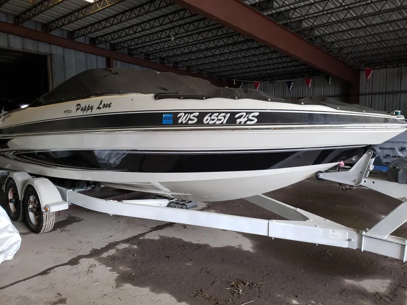 Slide: The Image of 2010 Glastron/Carlson GT225BR boat on trailer in storage facility. - 2