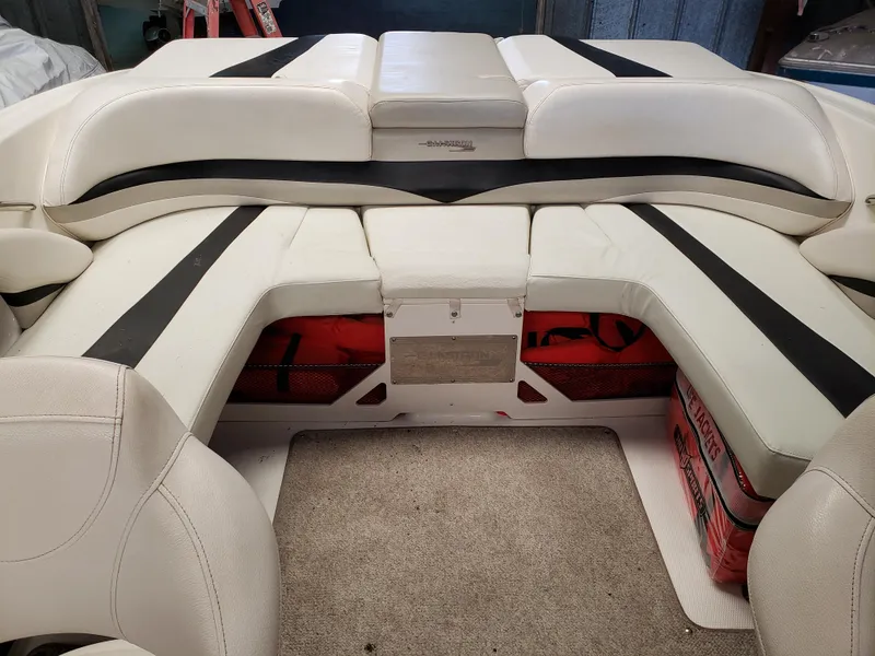 Slide: The Image of 2010 Glastron/Carlson GT225BR boat interior with white and black seating. - 4