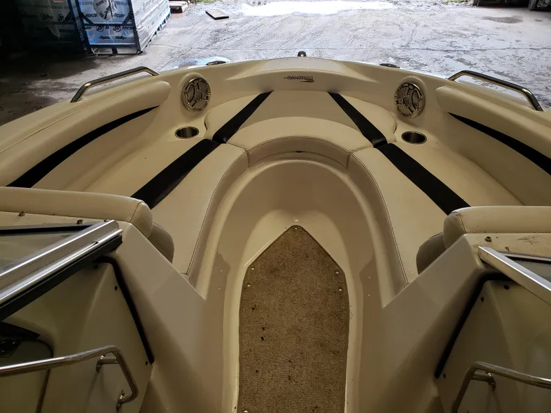Slide: The Image of 2010 Glastron/Carlson GT225BR boat interior with seating and cup holders. - 7