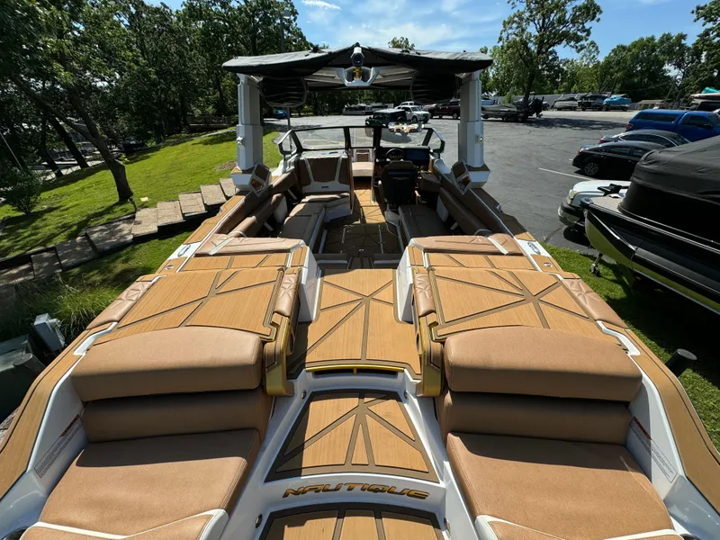 Slide: The Image of 2024 Nautique G25 Paragon boat with luxurious seating and modern design. - 5