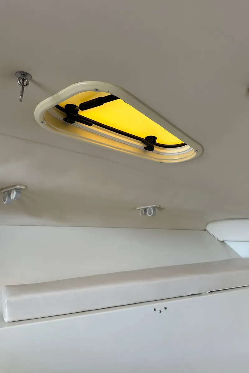 Slide: The Image of 2005 Hydra-Sports 33VX cabin interior with ceiling hatch and lighting fixtures. - 11