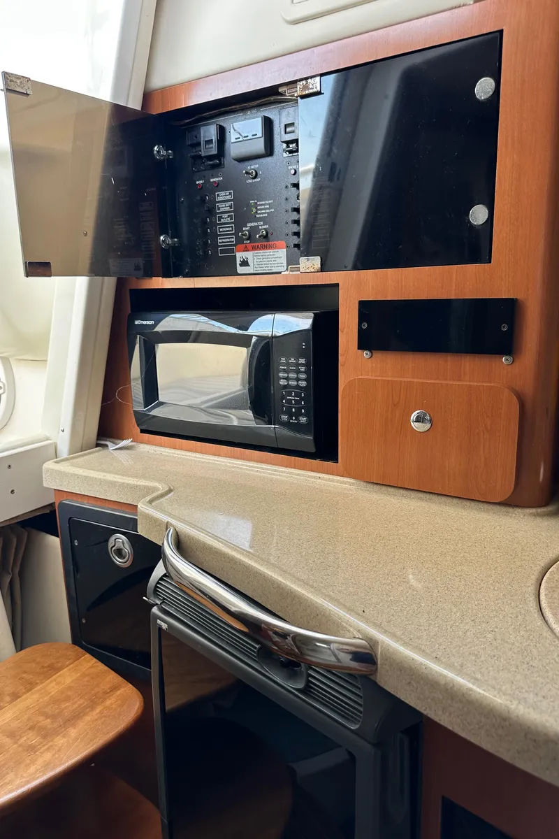 Slide: The Image of 2005 Hydra-Sports 33VX interior with microwave, control panel, and countertop. - 9