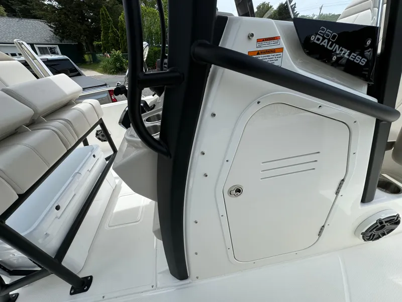 Slide: The Image of 2025 Boston Whaler 250 Dauntless interior, featuring seating and storage compartments. - 10