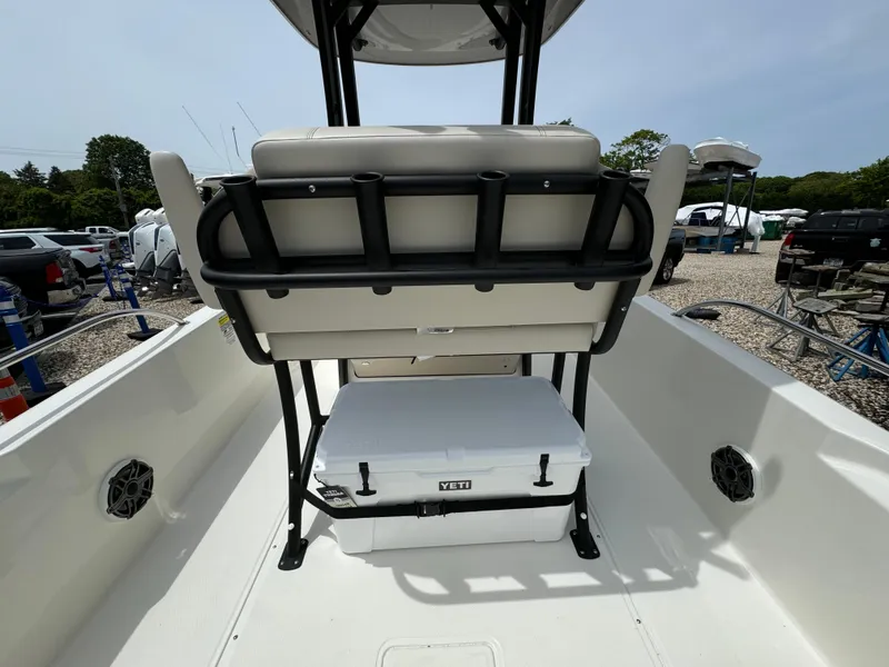 Slide: The Image of 2025 Boston Whaler 250 Dauntless boat interior with seating and Yeti cooler. - 11