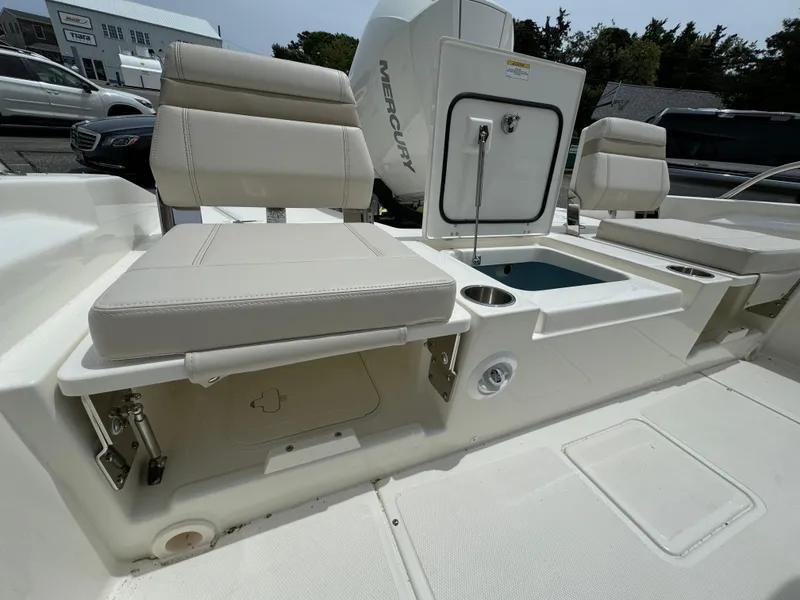 Slide: The Image of 2025 Boston Whaler 250 Dauntless boat interior with seating and storage compartments. - 23
