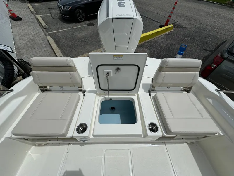 Slide: The Image of 2025 Boston Whaler 250 Dauntless boat interior with seating and storage compartments. - 24