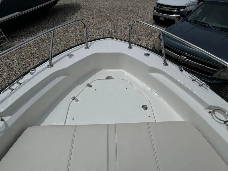 Slide: The Image of 2025 Boston Whaler 250 Dauntless boat bow with seating and stainless steel railings. - 9