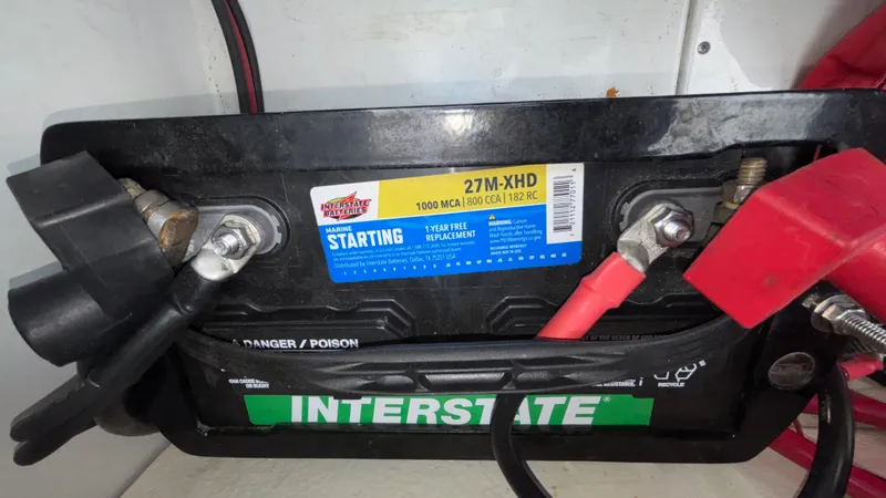 Slide: The Image of Interstate marine battery in a 2003 Baja 33 Outlaw boat, featuring 27M-XHD model. - 15