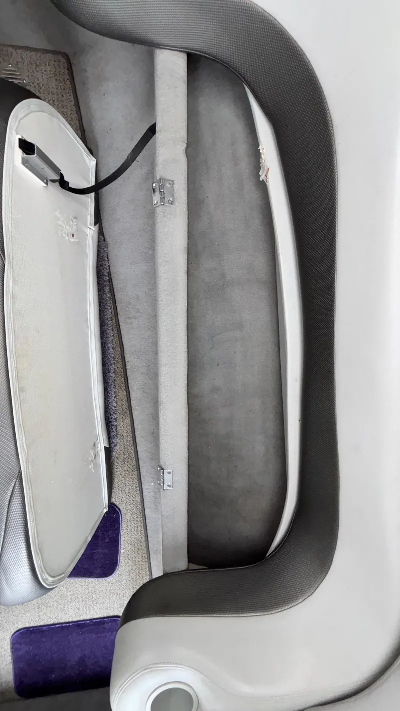 Slide: The Image of 2003 Baja 33 Outlaw interior detail with open storage compartment. - 29