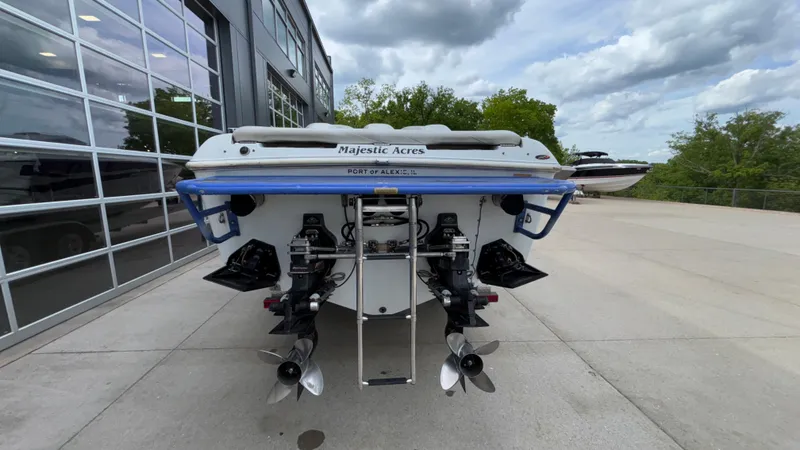 Slide: The Image of 2003 Baja 33 Outlaw boat rear view with dual propellers and ladder. - 5
