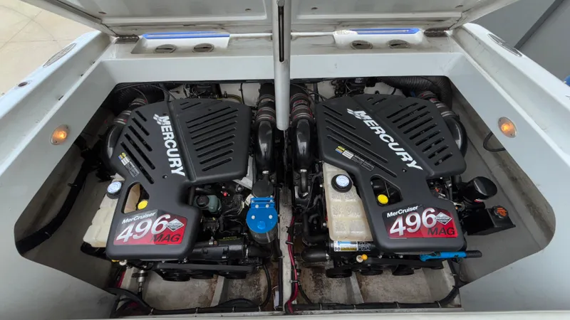 Slide: The Image of Twin Mercury 496 MAG engines in a 2003 Baja 33 Outlaw boat. - 6