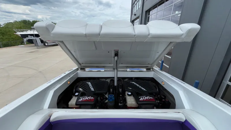 Slide: The Image of 2003 Baja 33 Outlaw boat engine compartment with twin Mercury 496 engines. - 7