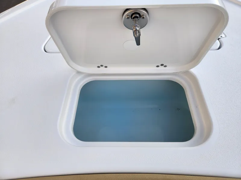 Slide: The Image of Open storage compartment on 2025 Sportsman Masters 247OE Bay Boat. - 11