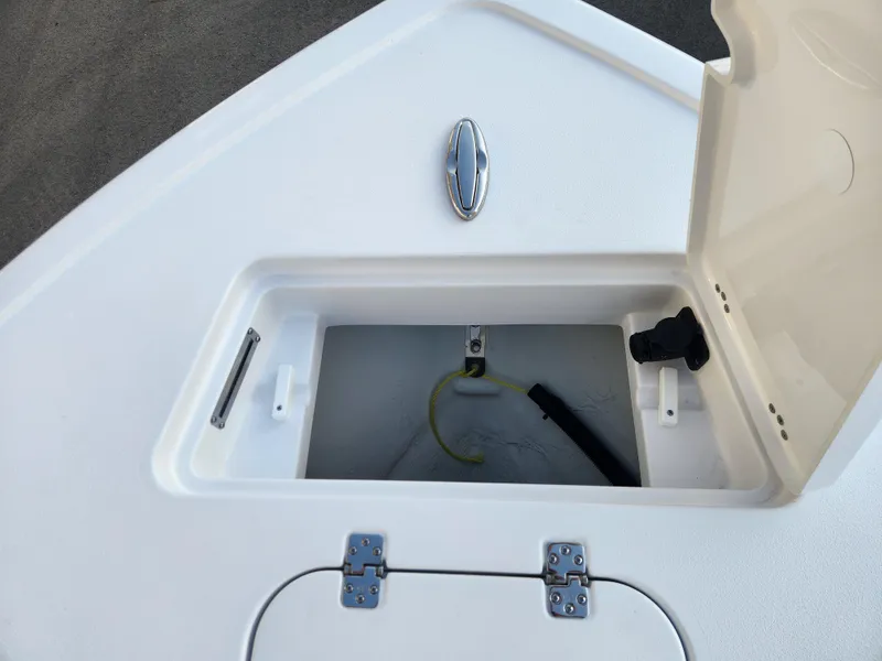 Slide: The Image of 2025 Sportsman Masters 247OE Bay Boat storage compartment with open hatch. - 12