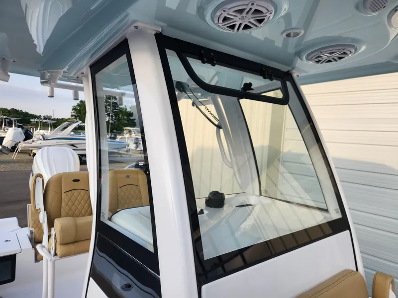 Slide: The Image of 2025 Sportsman Masters 247OE Bay Boat with modern helm and seating. - 13