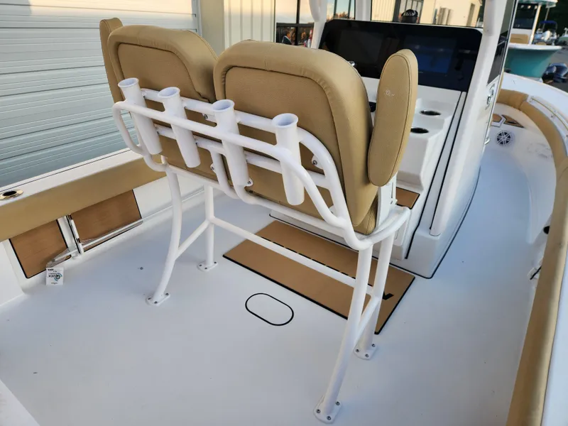 Slide: The Image of 2025 Sportsman Masters 247OE Bay Boat interior with dual seats and rod holders. - 18