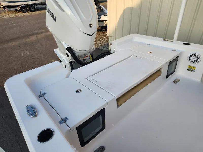 Slide: The Image of 2025 Sportsman Masters 247OE Bay Boat with Yamaha engine, featuring spacious deck and storage compartments. - 19