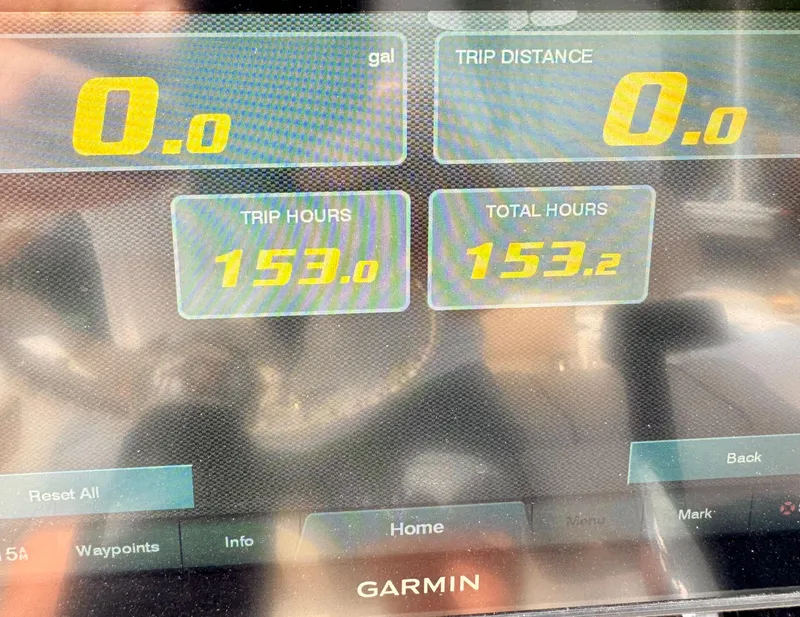 Slide: The Image of Garmin display showing trip and total hours for 2020 Sportsman Open 212 Center Console. - 11