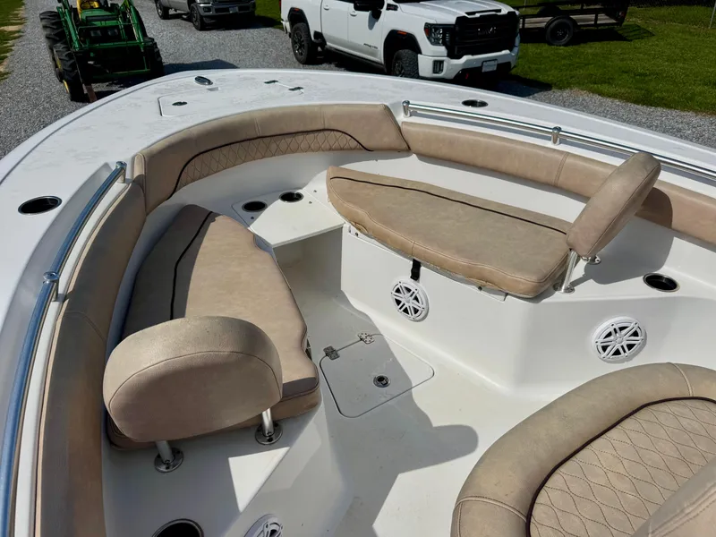 Slide: The Image of 2020 Sportsman Open 212 Center Console boat with beige seating and white deck. - 7