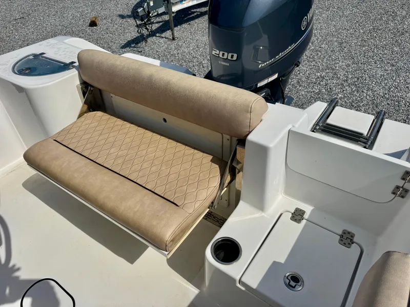 Slide: The Image of 2020 Sportsman Open 212 Center Console boat with beige seating and Yamaha 200 engine. - 9