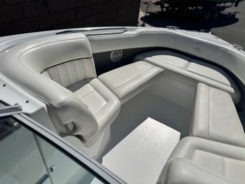 Slide: The Image of 2006 Cobalt 232 boat interior with white leather seating. - 14