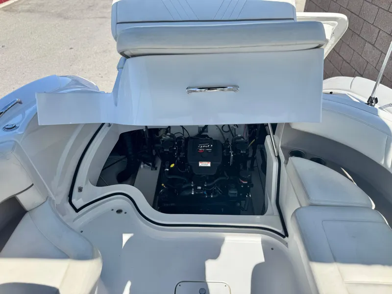 Slide: The Image of 2006 Cobalt 232 boat engine compartment with open hatch, showcasing interior mechanics. - 23