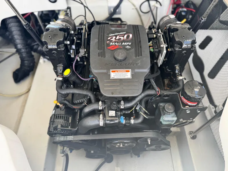 Slide: The Image of Engine of a 2006 Cobalt 232 boat, featuring a MerCruiser 350 MAG MPI. - 24