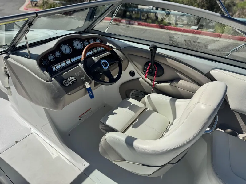 Slide: The Image of 2006 Cobalt 232 boat interior with steering wheel and dashboard controls. - 29