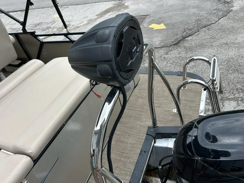 Slide: The Image of 2018 Avalon 2485 LSZ Cruise boat with speaker and motor on deck. - 12