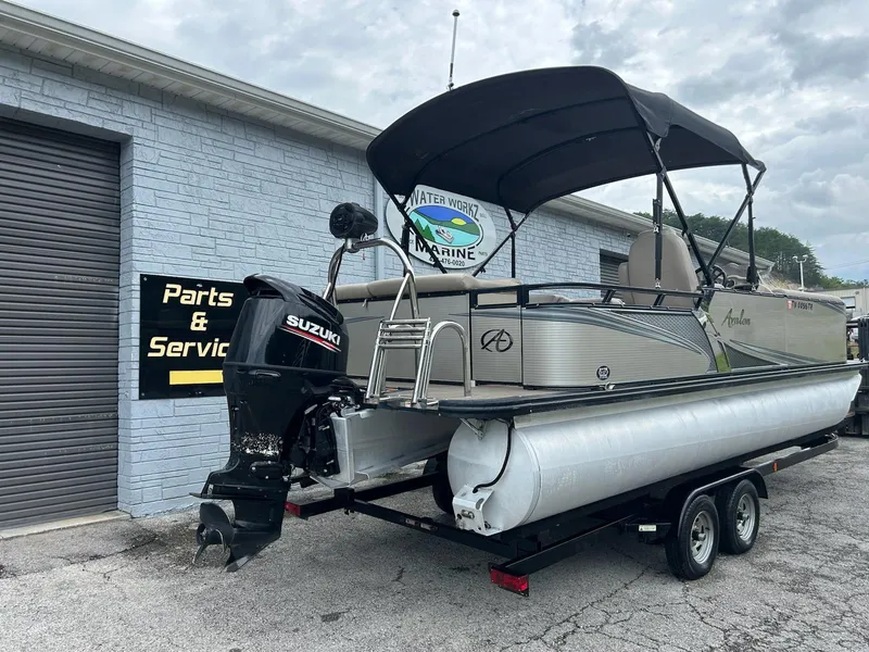 Slide: The Image of 2018 Avalon 2485 LSZ Cruise pontoon boat with Suzuki outboard motor on trailer. - 4