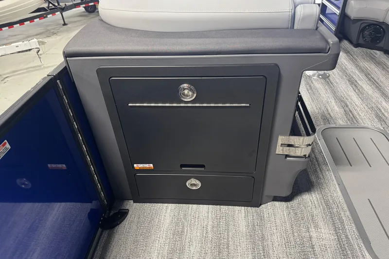 Slide: The Image of 2026 Bennington 24 MSB boat interior storage compartment with sleek design and modern features. - 11